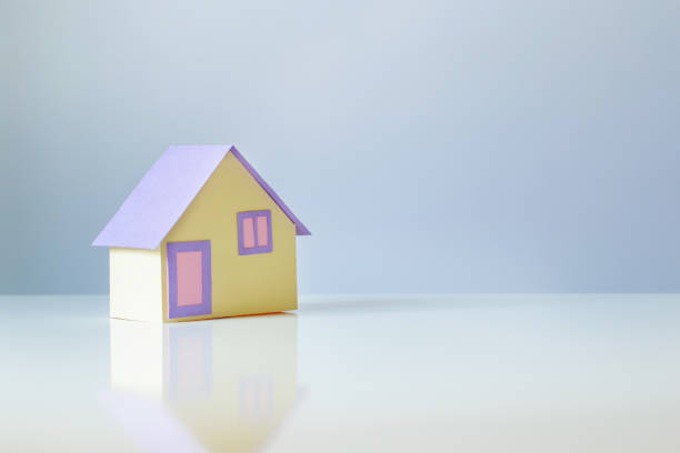 istock little paper house on white background 1492865875