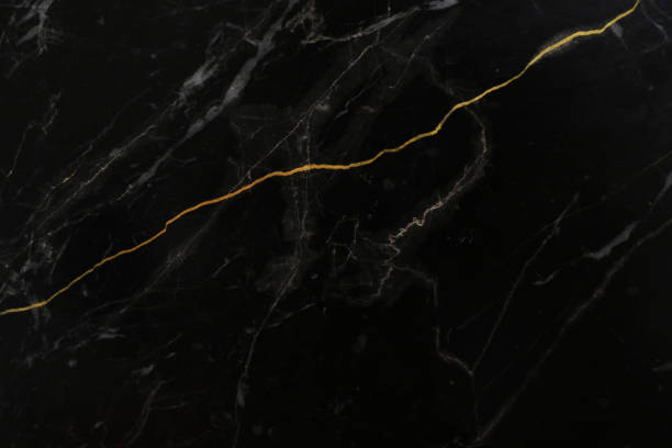 istock Black and white marble stone natural pattern texture with gold line background. 1492867156