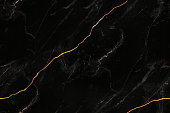 Black and white marble stone natural pattern texture with gold line background.