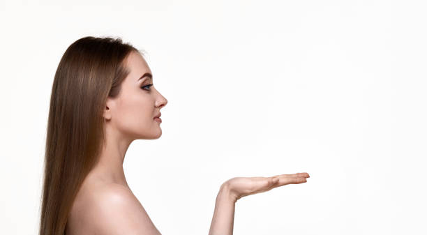 istock woman holding on open arm copy space on white background. 1492869446