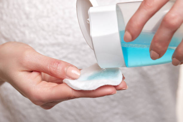 istock female hands using toner and cotton pad to remove makeup 1492869634