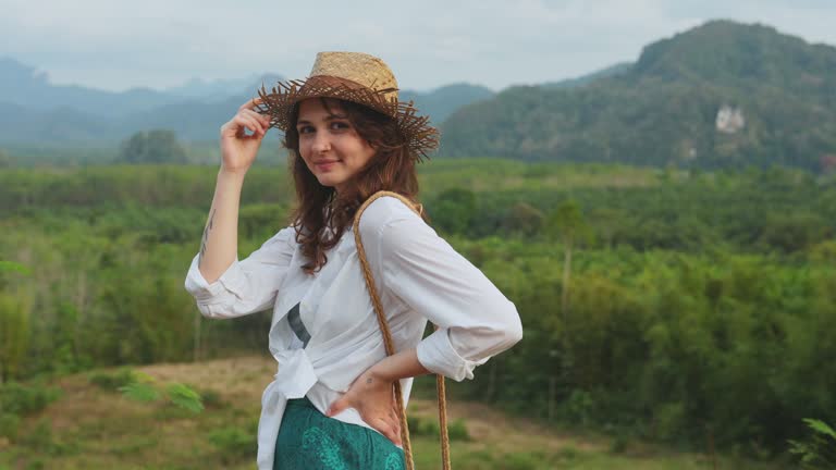 Woman looking at Khao Sok National park mountains