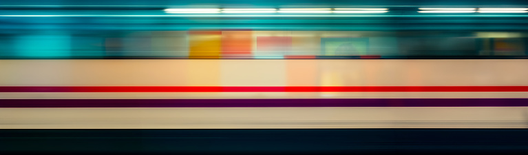 Motion blur of high speed train in subway, panoramic view