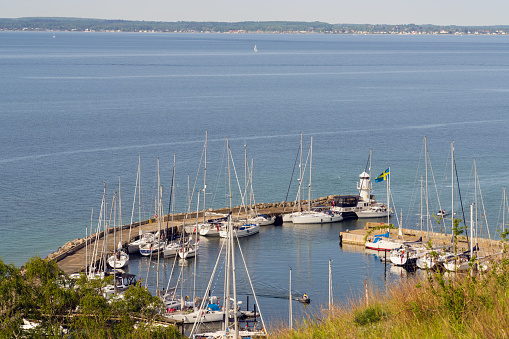 View over Kyrkbacken harbor on the Swedish island Ven in the Oresund strait. Denmark can be seen in the background.