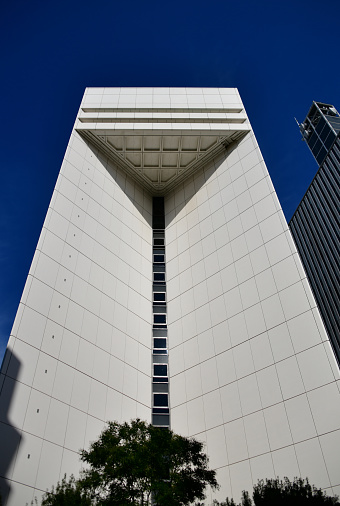 Tokyo, Japan: Aozora Bank headquarters ('あおぞら銀行'), Tokyodo Chiyoda Building, facing Uchibori Street, designed by Nikken Sekkei Co. and built by Kajima Corporation - Aozora is a commercial bank, the successor of the Nippon Credit Bank (NCB) - One of the constituent stocks of the Nikkei Stock Average, Kudan-Minami, Chiyoda-ku.