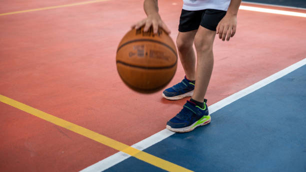 istock boy is dripling on basketball court horizontal still 1492874030