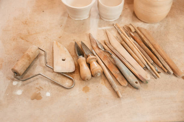 istock Pottery tools. Close up view of the table with instruments 1492874195