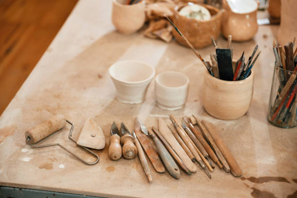 istock Pottery tools. Close up view of the table with instruments 1492874198