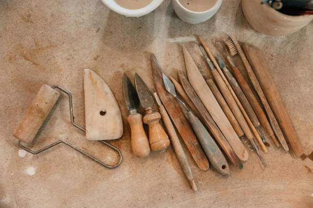 istock Pottery tools. Close up view of the table with instruments 1492874243