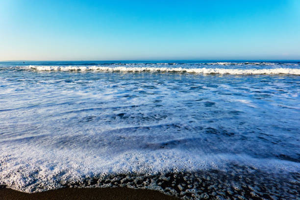istock Scenic view of beach against blue clear sky during sunrise 1492875210