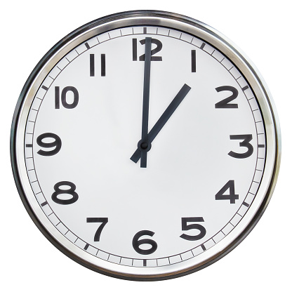 Office clock showing one o'clock isolated on a white background
