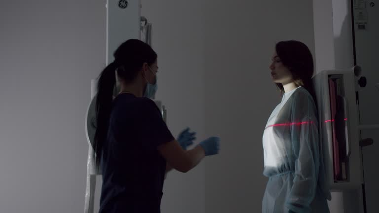 Healthy Patient Undergoes Routine Scanning with the Nurse's Help.
