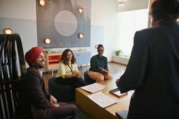istock Diverse group of engineers team members engaged in a conversation 1492877588
