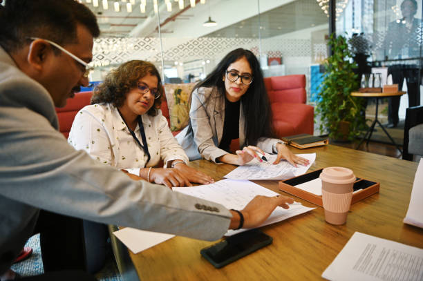 istock Diverse group of engineers discussing together in a meeting room 1492877715