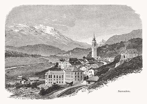 Historical view of Samedan (official until 1943 Samaden) - a village and municipality in the Maloja Region in the Swiss canton of Graubünden (Grisons). In the foreground the Bernina Hotel (opened in 1865), one of the oldest hotels in the Engadin. Wood engraving after a drawing by Edward Theodore Compton (English painter, 1849 - 1921), published in 1877.
