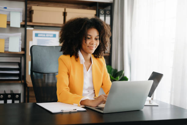 istock African businesswoman working in the office with working notepad, tablet and laptop documents 1492884892