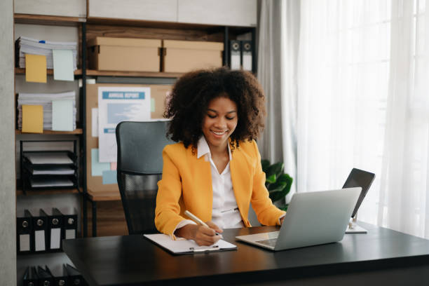 istock African businesswoman working in the office with working notepad, tablet and laptop documents 1492884893