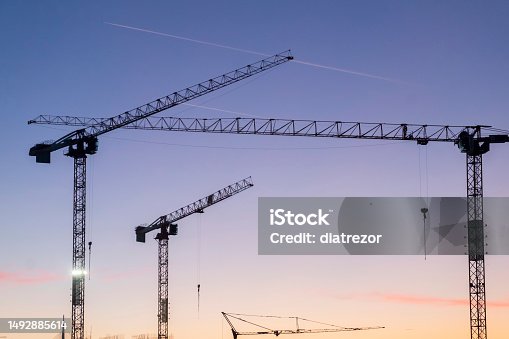 istock cranes on the construction site, dusk on the construction site 1492885614