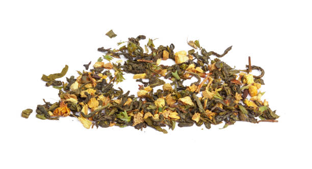 istock Green tea with dry flowers on white background. Close up 1492887709