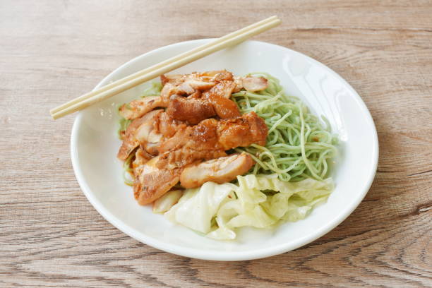 istock jade Chinese egg noodles topping Korean fried slice chicken with cabbage dressing sauce 1492887784