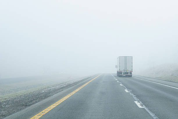 istock Semi-Truck Drives Into Dense Fog 149288823