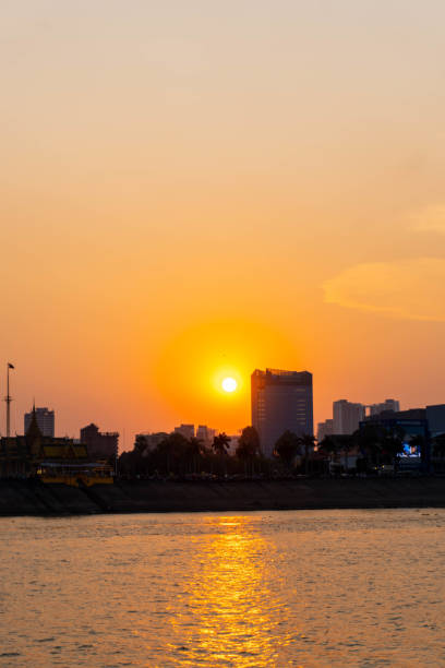 istock Vibrant orange sunset caught from a sunset boat in phnom penh 1492888750