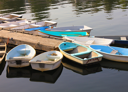 Colorful rowboats tied to dock in Ogunquit, ME