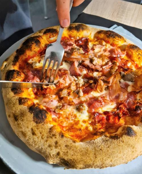 istock pizza with mozzarella, sausage and smoked bacon 1492892265