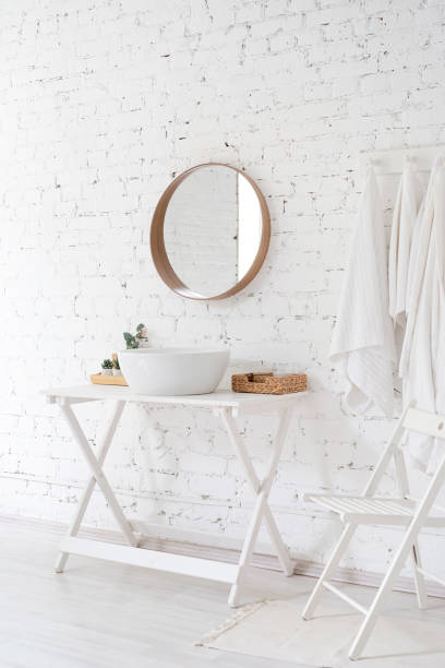 istock modern minimal style bathroom, sink, mirror and the table on brick wall background 1492893629