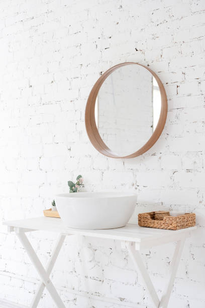 istock modern minimal style bathroom, sink, mirror and the table on brick wall background 1492893712