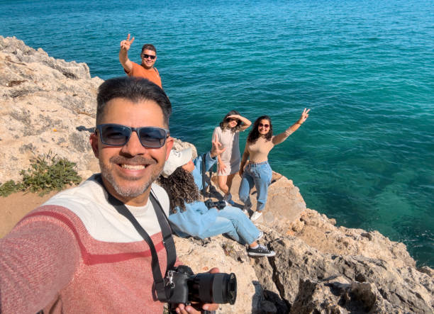 istock Tourists taking a selfie overlooking the sea 1492894425