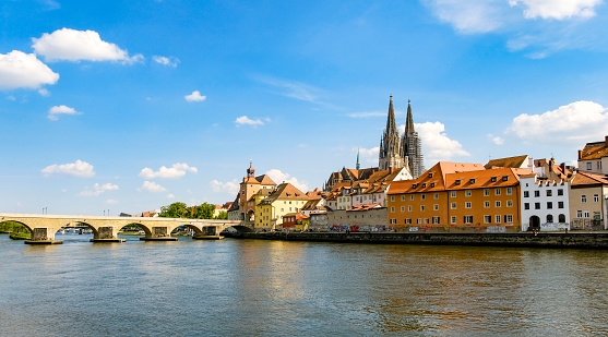 Trip to Regensburg - Bavaria. Walk along the Danube river. View to the cathedral St. Peter and the old stone bridge.