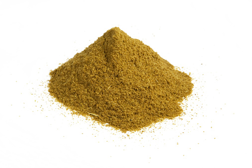 A heap of cumin isolated on white