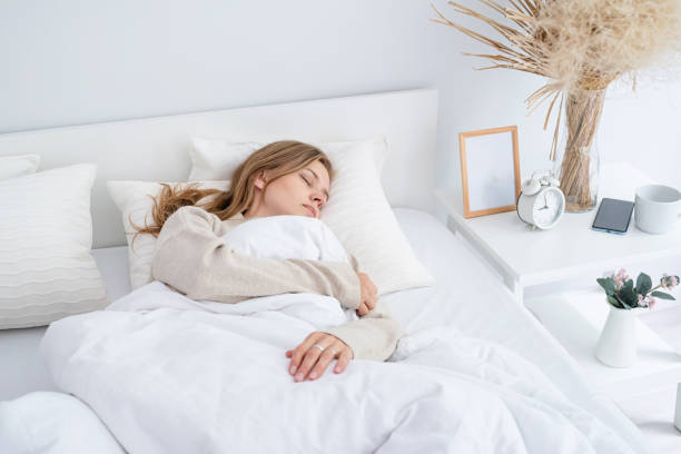 istock Woman sleeping at bed at home 1492898556