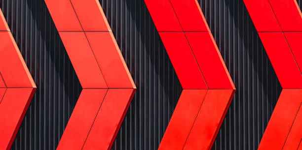 Red aluminum composite tile in Arrow Pattern on black Corrugated Steel Wall Background