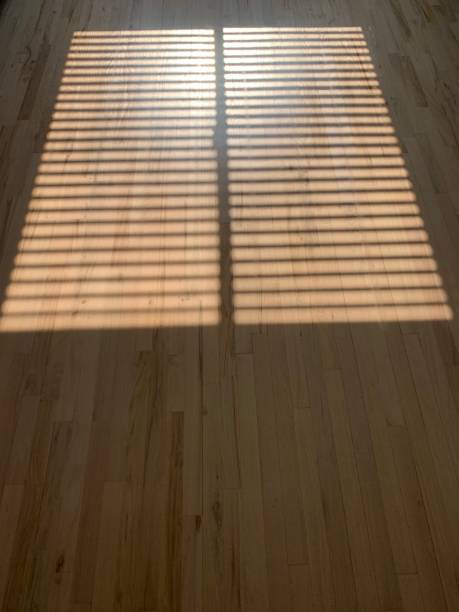 Sun reflection on wooden floor stock photo