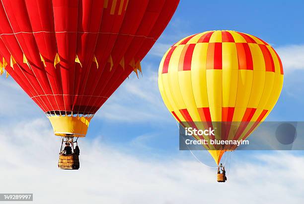 Two Colorful Hot Air Balloons Stock Photo - Download Image Now - Hot Air Balloon, People, Riding