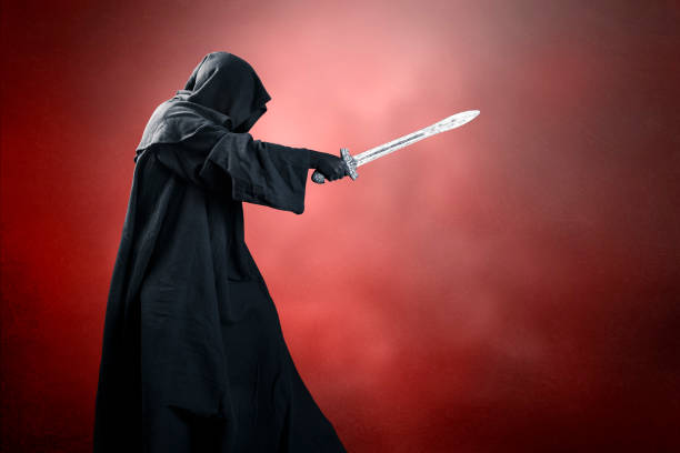 istock Dark knight with sword over dark red misty background 1492900743