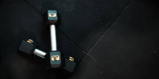 istock 3 kg gym dumbbells placed on the gym's rubber floor 1492902243