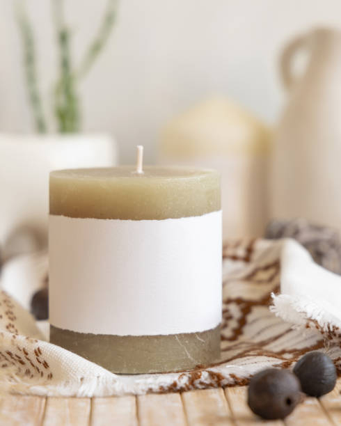 istock Candle with blank label on a wooden table Close up, copy space, boho ethnic mock up 1492902287