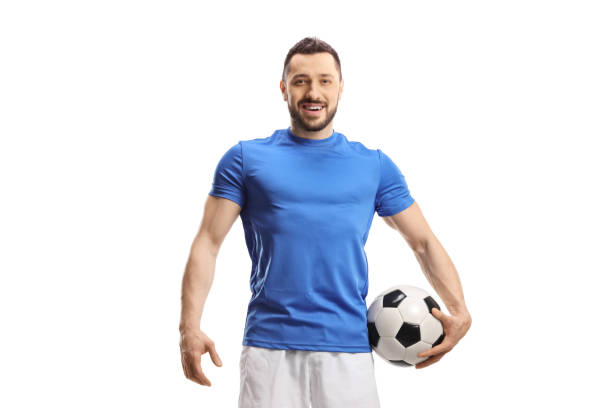 istock Soccer player with a ball under arm posing 1492903347