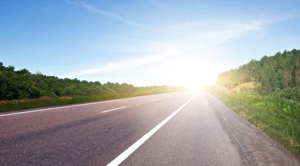 istock Road. Highway surrounded by summer natural landscape 1492907311
