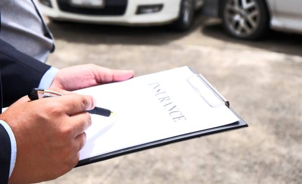 istock Loss Adjuster Insurance Agent Inspecting Damaged Car. 1492911506