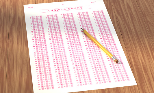 Answer Sheet And Pencil On The Table