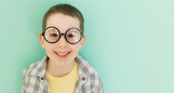 istock Caucasian boy in eyeglasses copy space 1492917169