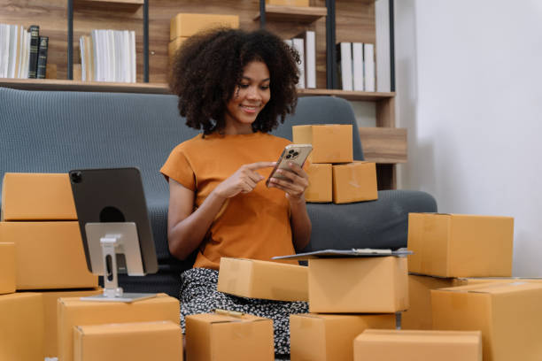 istock Startup or small business entrepreneur in e commerce, or logistics in remote startup at home. African American female owner selling online on the Internet, SME, shipping boxes, store success. 1492918365