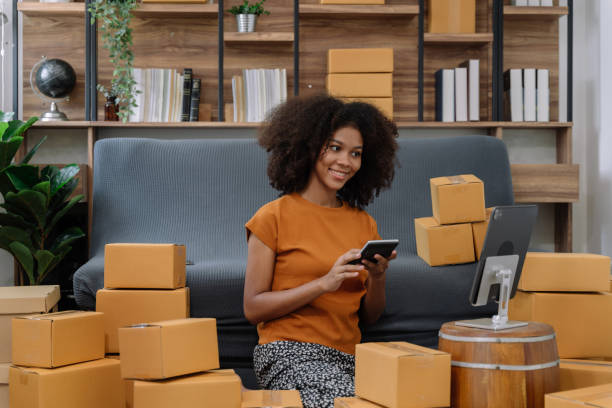 istock Startup or small business entrepreneur in e commerce, or logistics in remote startup at home. African American female owner selling online on the Internet, SME, shipping boxes, store success. 1492918369