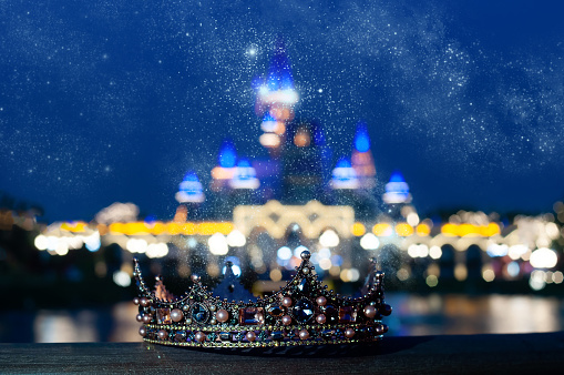 Royal crown, magic fairy tale on castle background