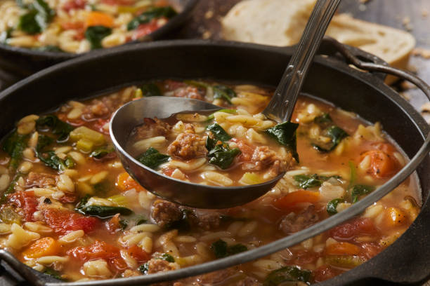 Italian Sausage and Spinach Orzo Soup stock photo