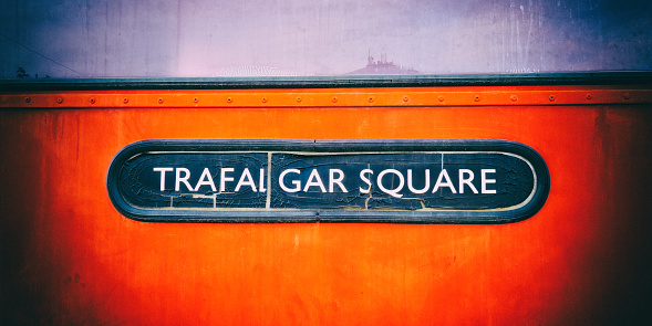 Trafalgar Square vintage sign on a London bus. Vintage camera filter added to image